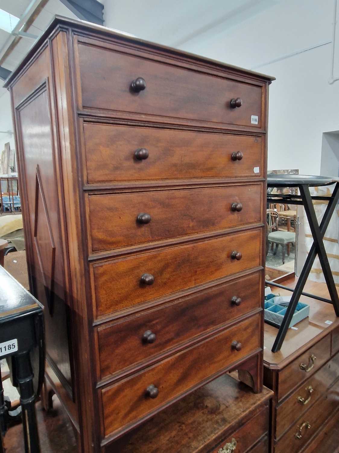 Lot 1186 - A hardwood tall chest of six drawers. 64 x 50...
