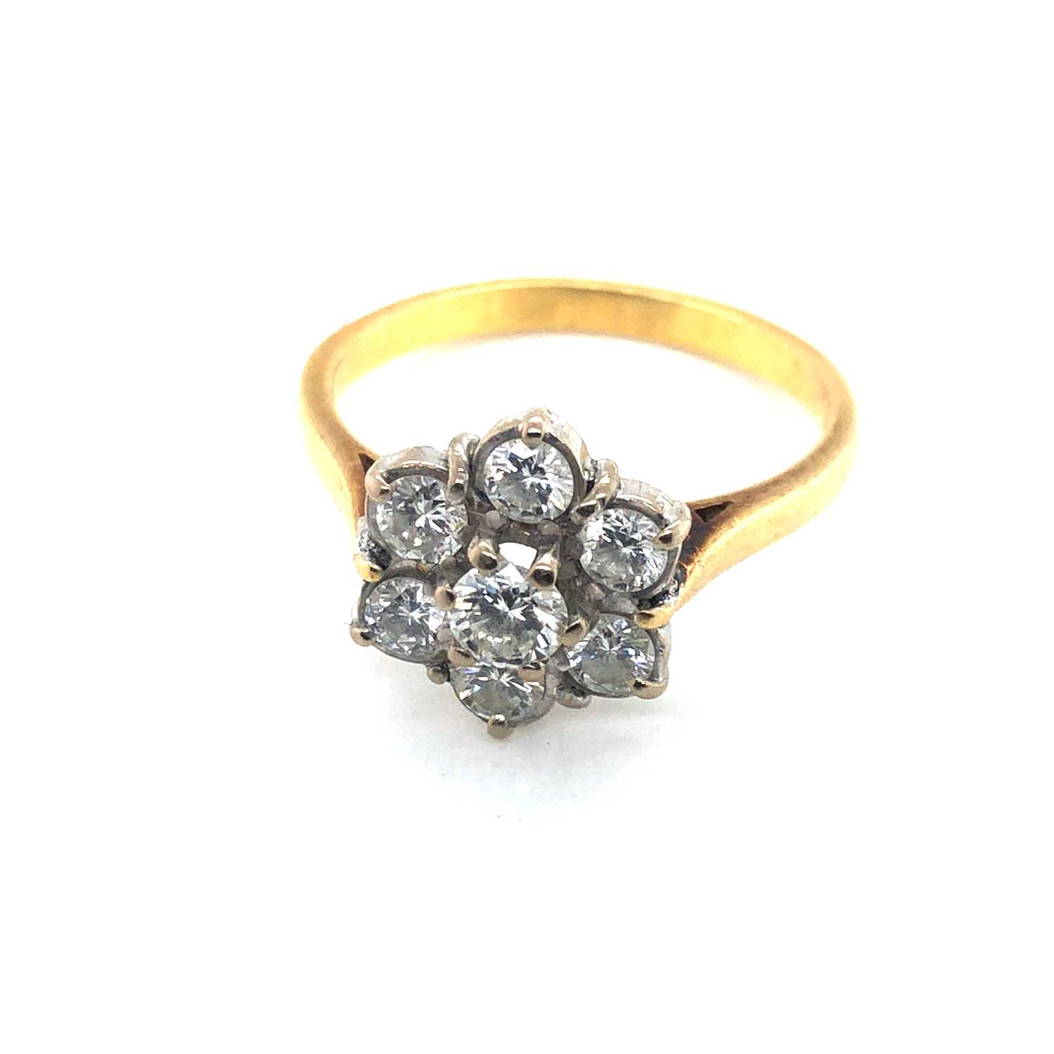 Lot 63 - A vintage 18ct hallmarked gold seven-stone...