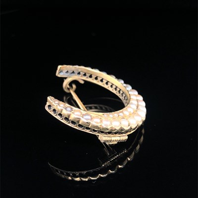 Lot 117 - An antique crescent moon seed pearl brooch,...