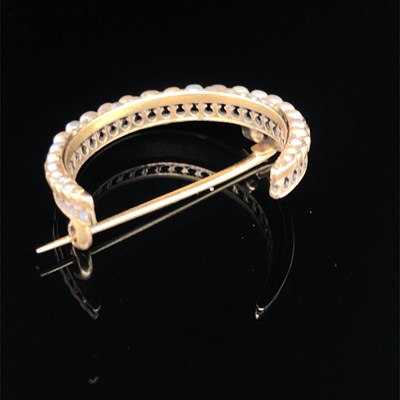 Lot 117 - An antique crescent moon seed pearl brooch,...