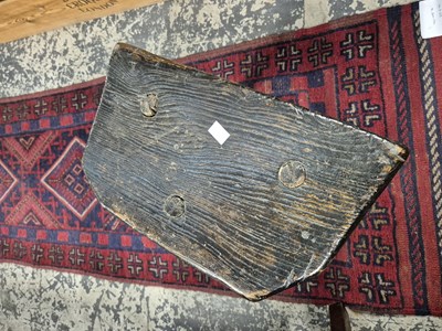 Lot 1249 - Two antique rustic milking stools.