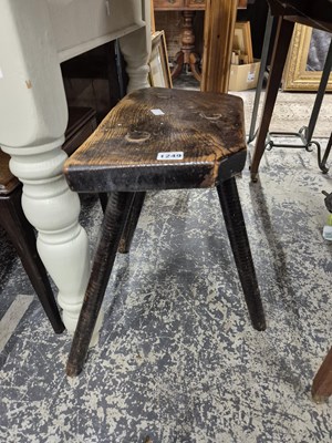 Lot 1249 - Two antique rustic milking stools.
