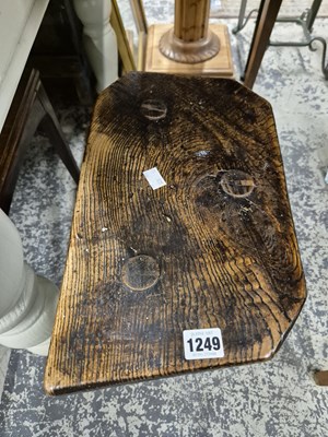 Lot 1249 - Two antique rustic milking stools.