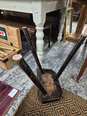 Lot 1249 - Two antique rustic milking stools.