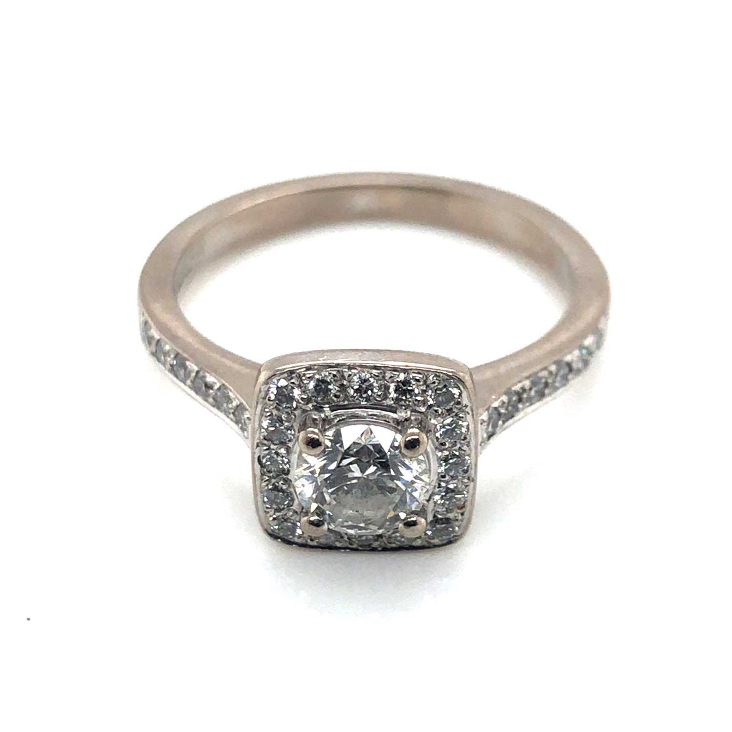 Lot 90 - An 18ct white gold diamond ring. The central...