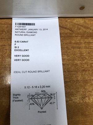Lot 90 - An 18ct white gold diamond ring. The central...