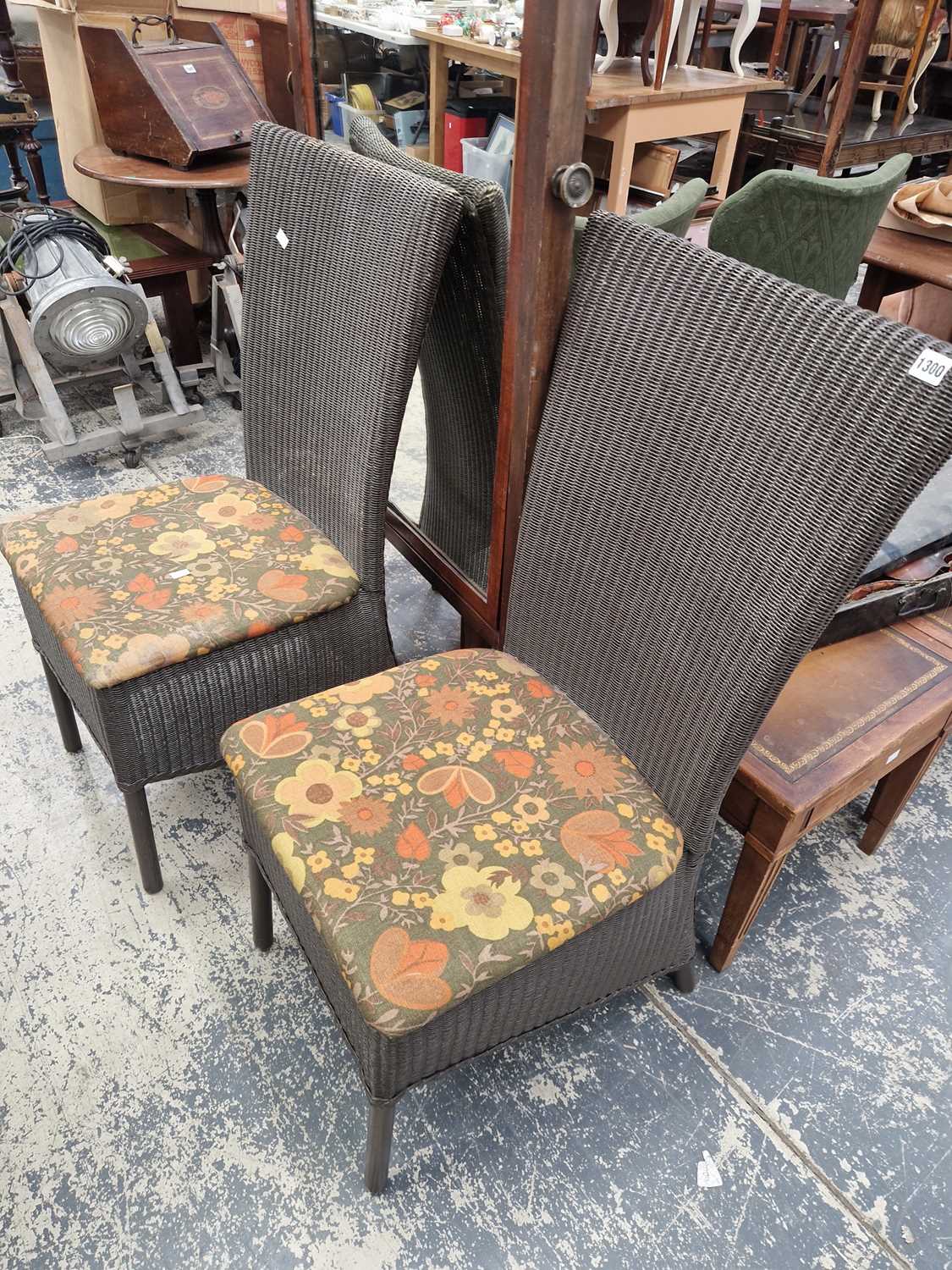 Lot 1300 - A pair of loom conservatory dining chairs.