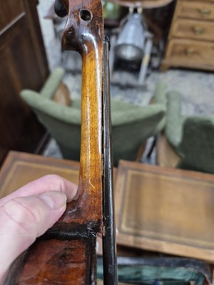 Lot 1303 - An antique violin in pine case. LOB 37 cm