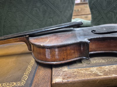 Lot 1303 - An antique violin in pine case. LOB 37 cm