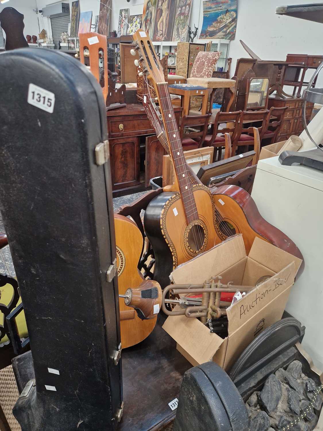 Lot 1315 - Three acoustic guitars; two trombones; several...
