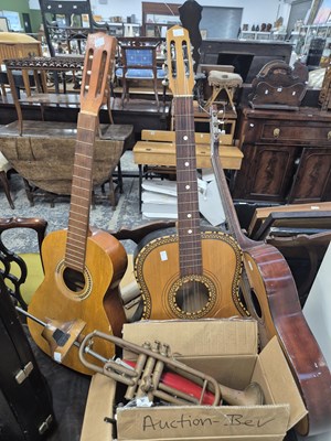 Lot 1315 - Three acoustic guitars; two trombones; several...