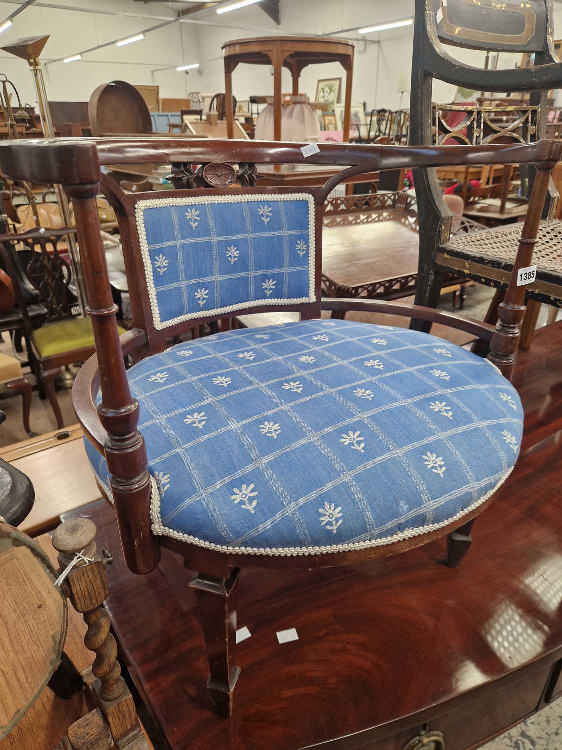 Lot 1385 - An Edwardian tub form salon chair.