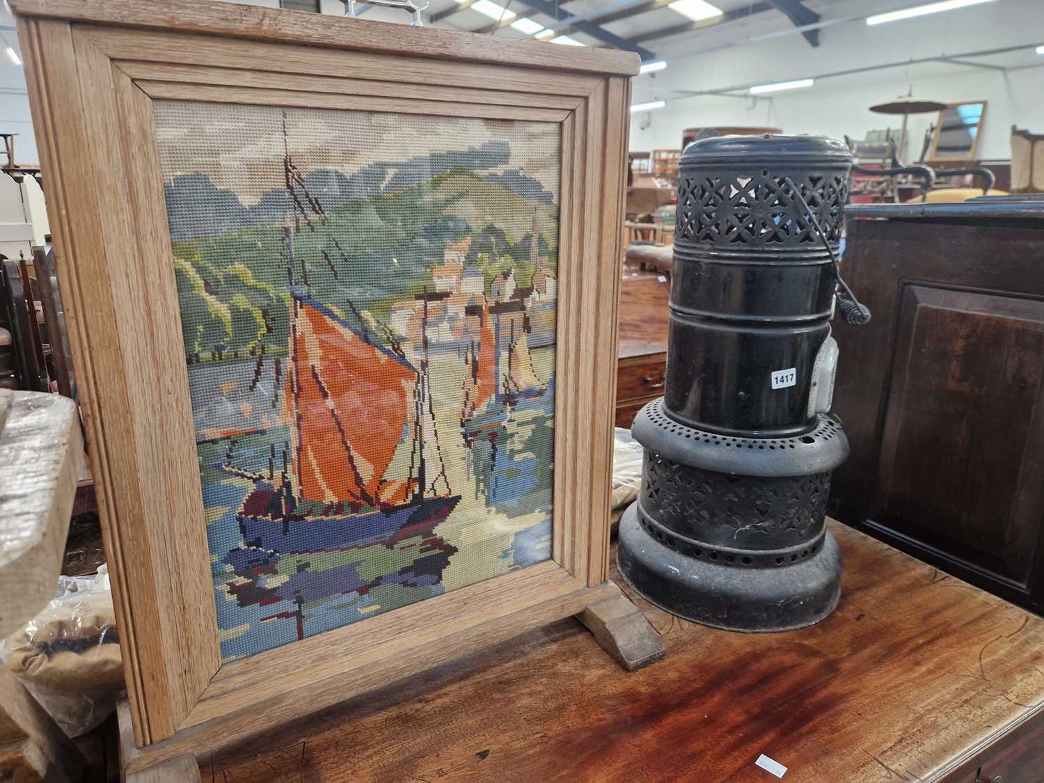 Lot 1417 - A vintage Valour parafin heater and a firescreen.