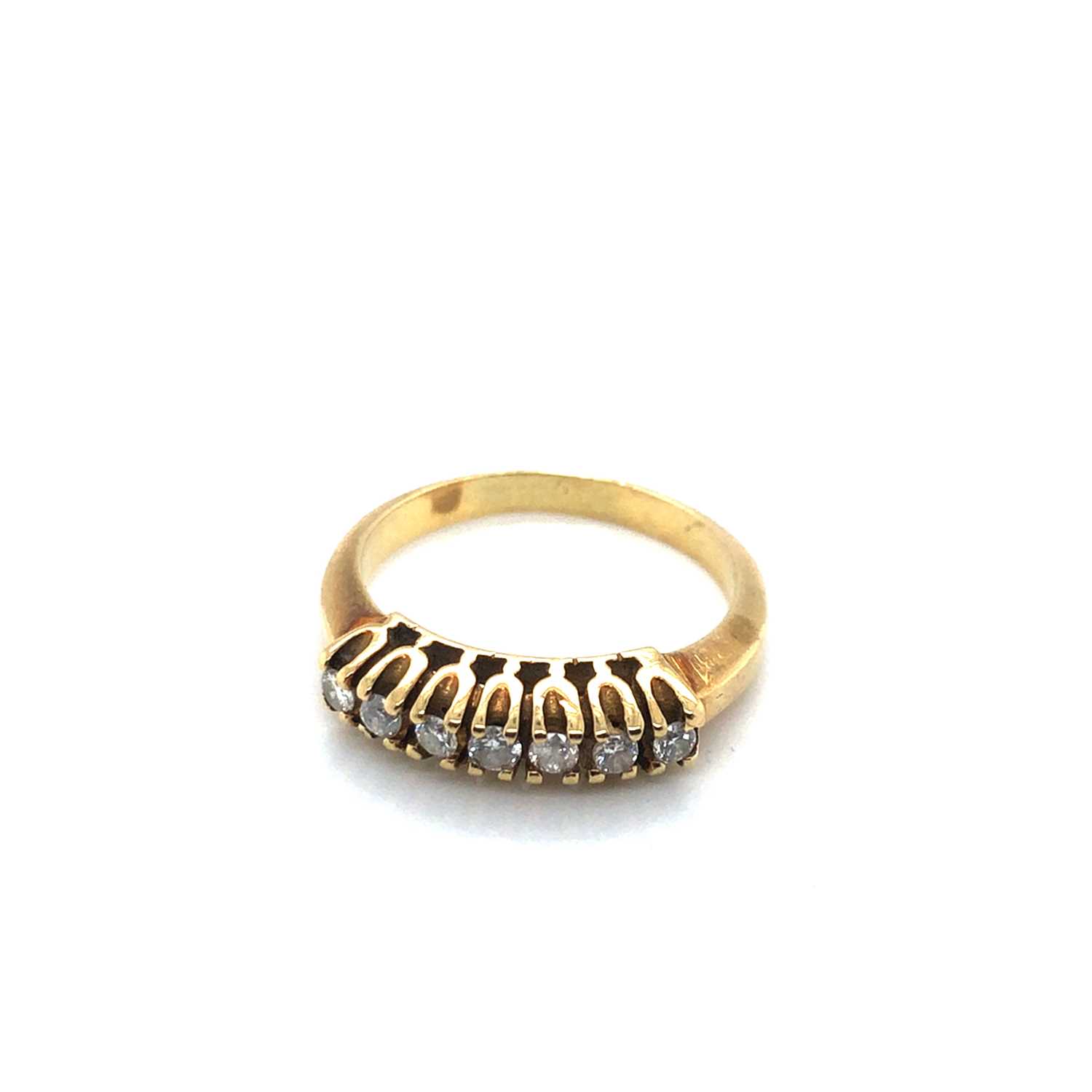 Lot 146 - A seven-stone diamond half eternity style ring,...