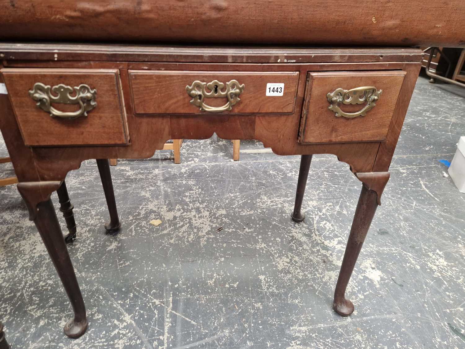 Lot 1443 - A Georgian mahogany three drawer lowboy side...