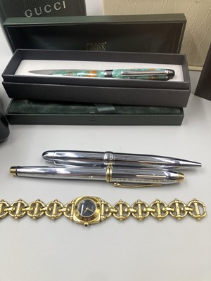 Lot 174 - A vintage Gucci watch reference number 6400L ...