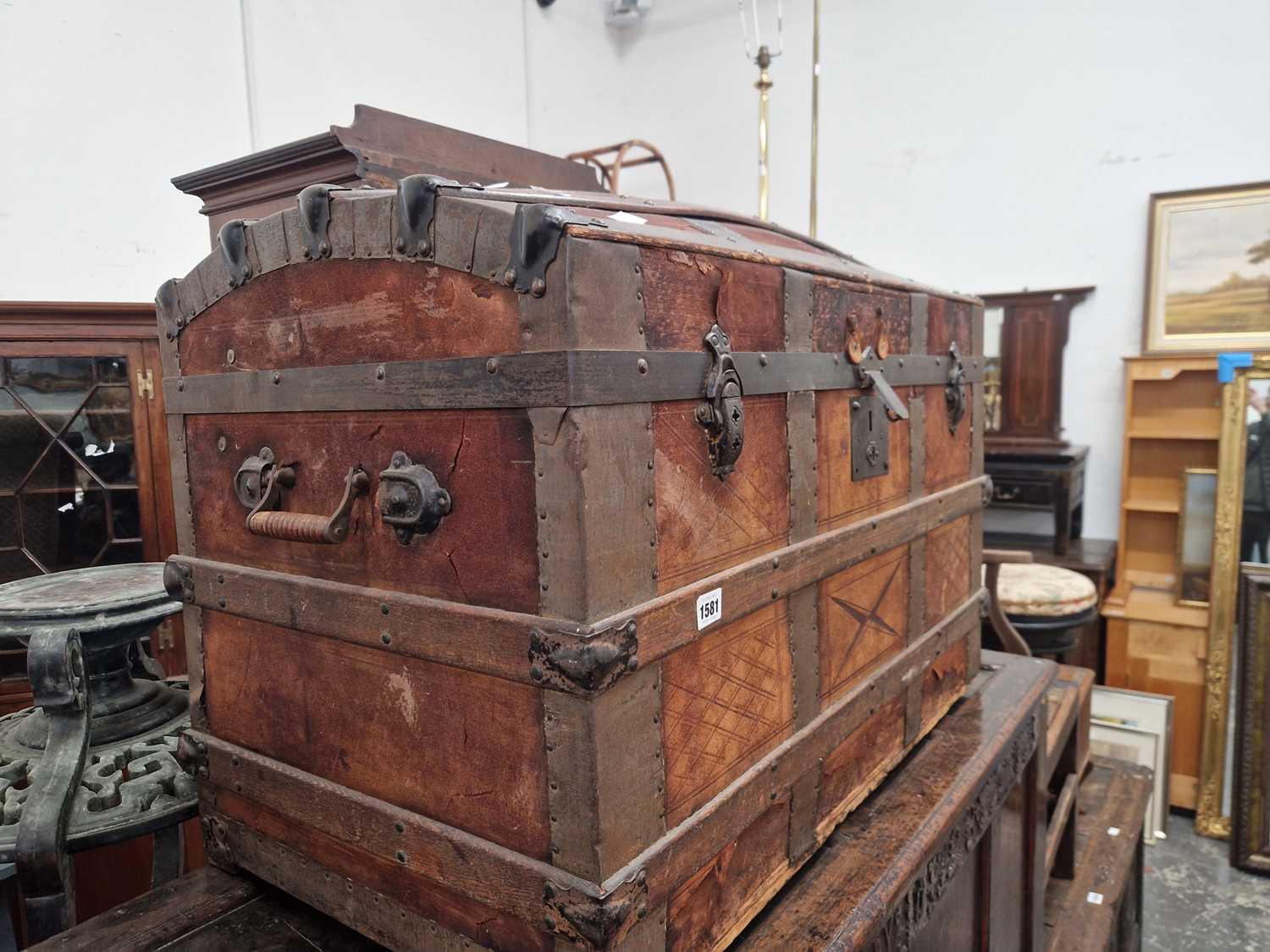 Lot 1581 - A vintage wood slatted dome top cabin trunk.