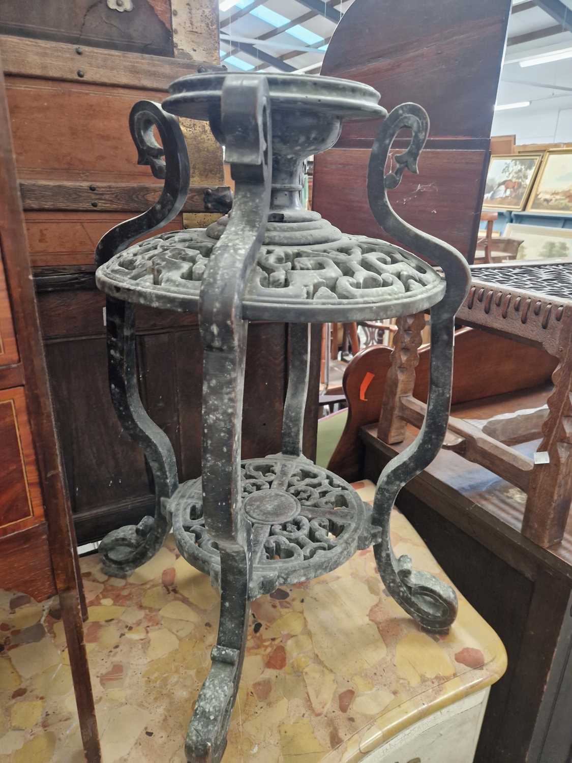 Lot 1594 - An antique oriental carved urn stand.