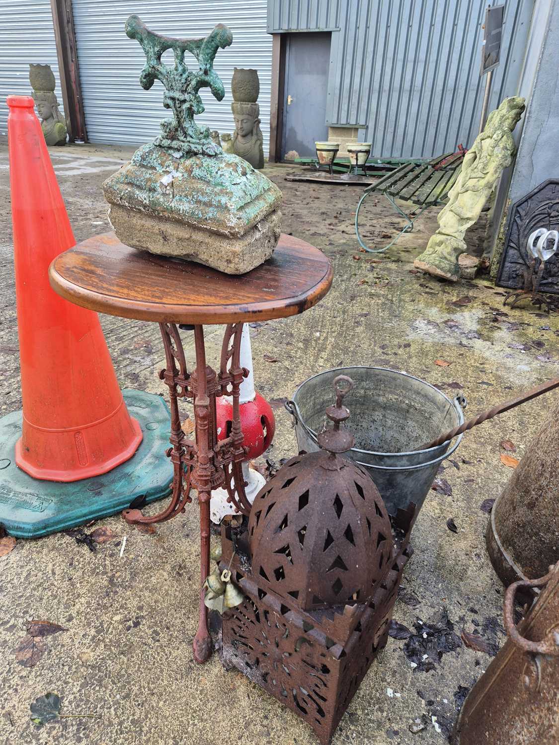 Lot 732 - A cast metal table, a bootscraper, a metal...