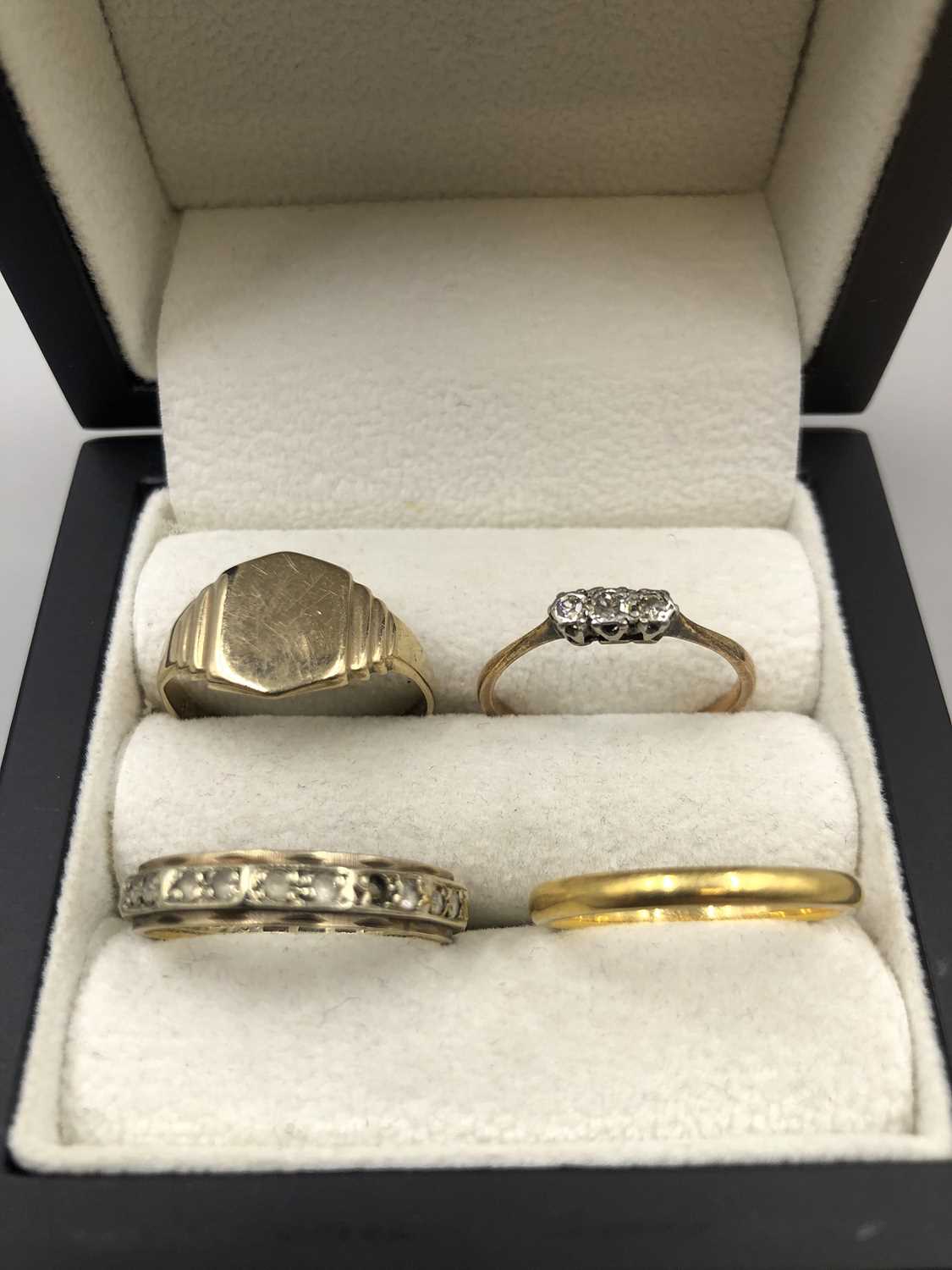 Lot 196 - Four gold rings including a 22ct gold wedding...
