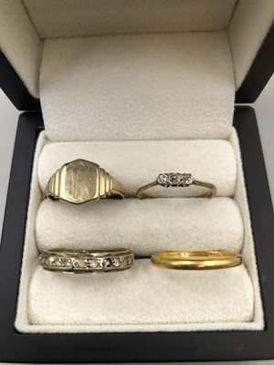 Lot 196 - Four gold rings including a 22ct gold wedding...
