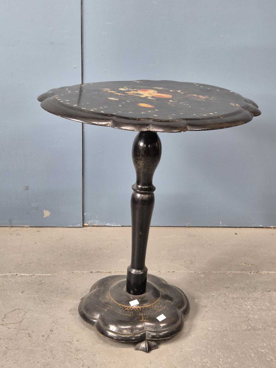 Lot 940 - A Victorian papier mache tilt-top table.