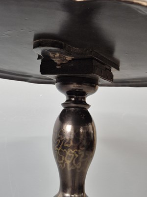 Lot 940 - A Victorian papier mache tilt-top table.