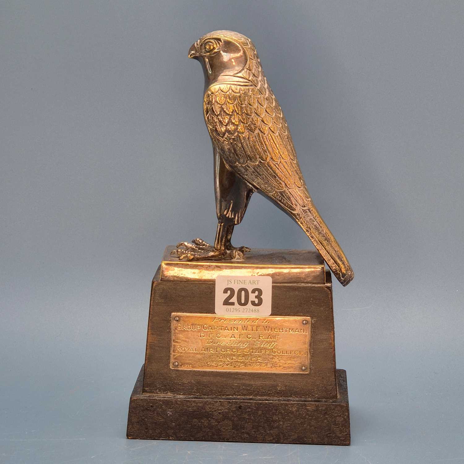 Lot 203 - An electroplate hawk trophy on a wooden plinth...
