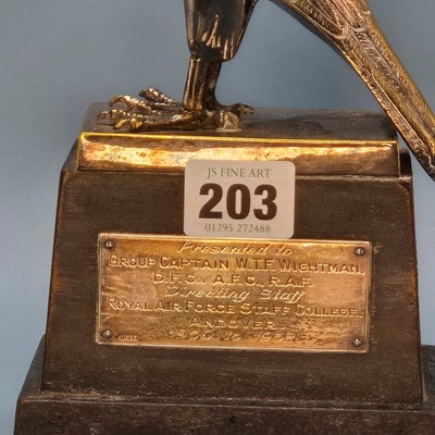Lot 203 - An electroplate hawk trophy on a wooden plinth...