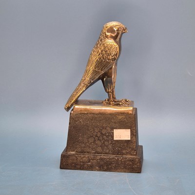 Lot 203 - An electroplate hawk trophy on a wooden plinth...