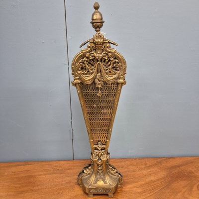 Lot 216 - A brass fire screen of eight pierced leaves...