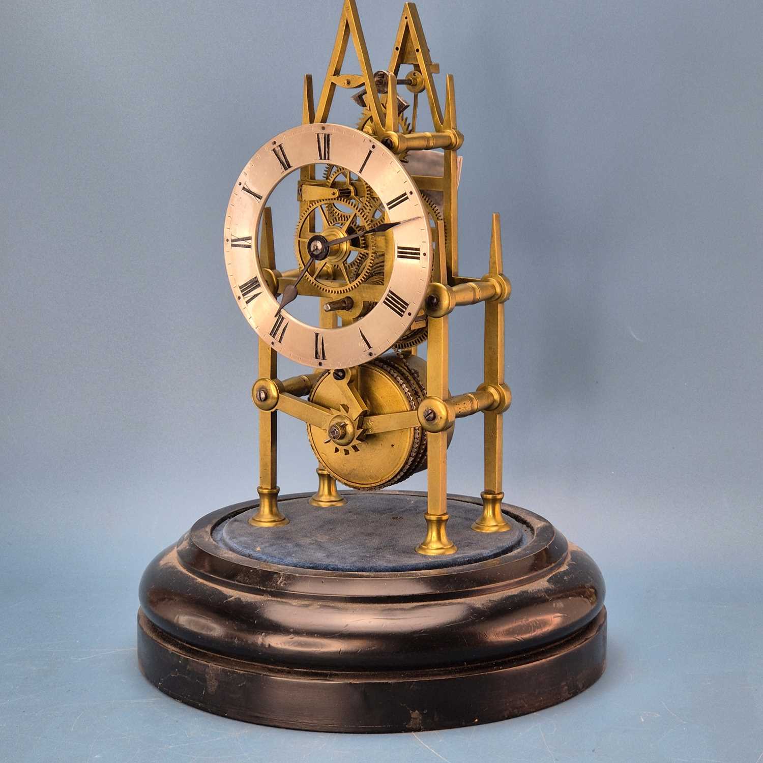Lot 237 - A fusee skeleton clock under a dome on an...