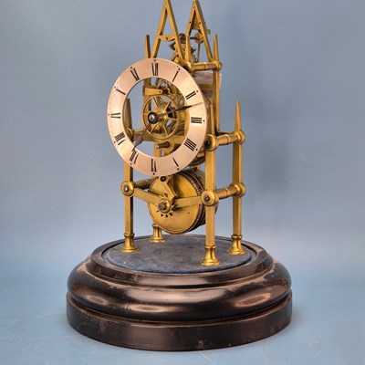 Lot 237 - A fusee skeleton clock under a dome on an...
