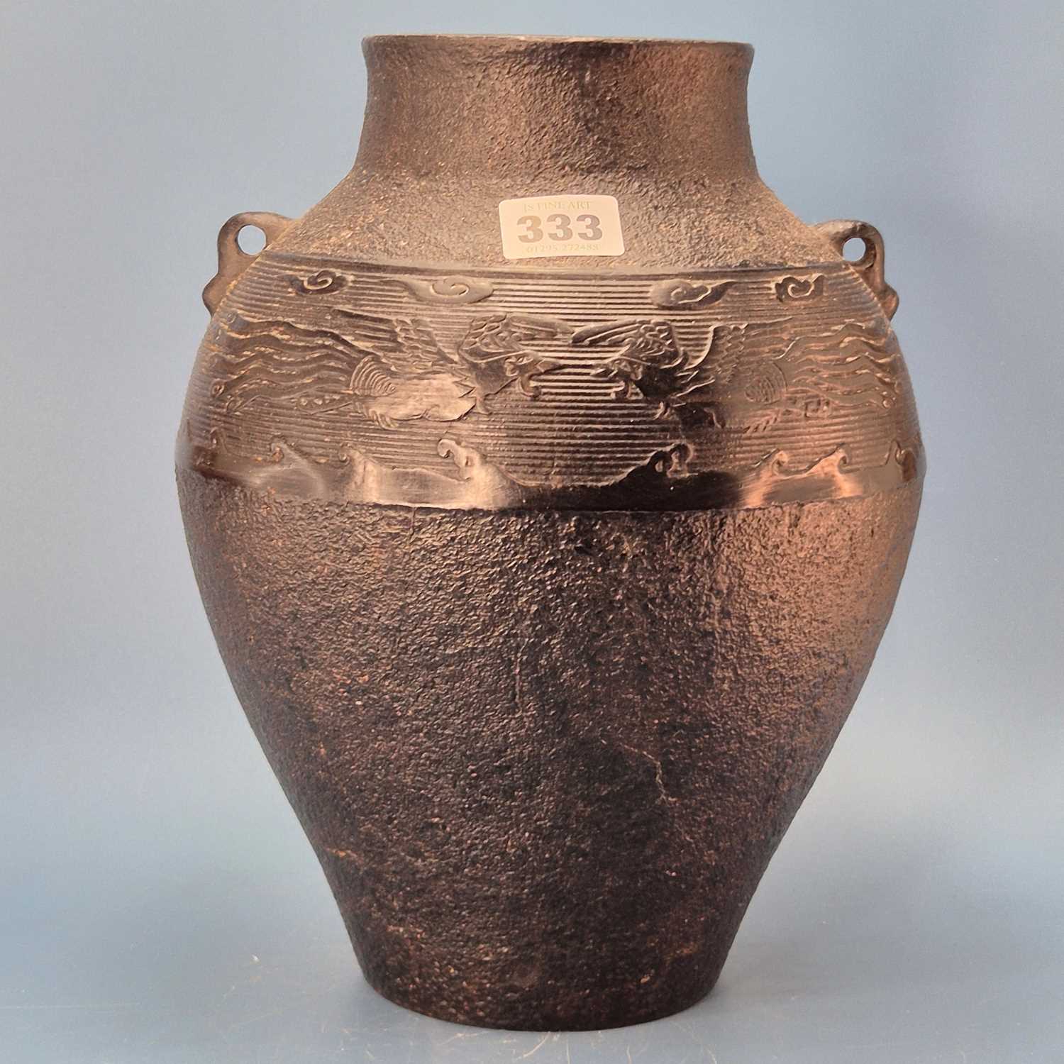 Lot 333 - A Chinese cast iron two handled vase with a...