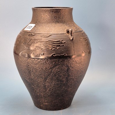 Lot 333 - A Chinese cast iron two handled vase with a...