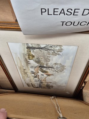 Lot 259 - A sepia tinted photograph of a shoreline and...