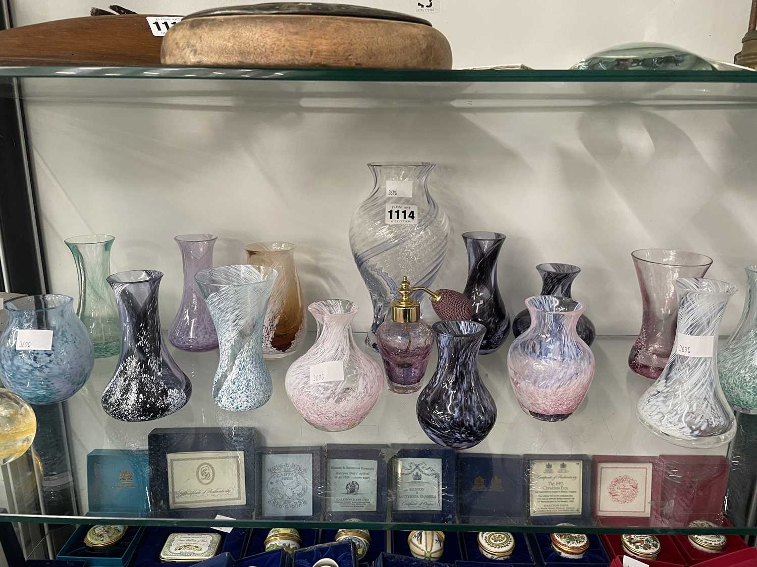 Lot 1114 - A collection of Caithness vases and a paperweight