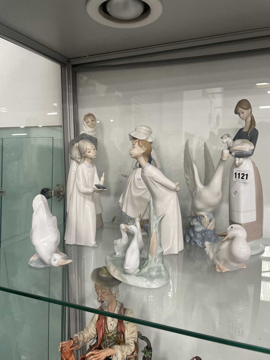 Lot 1121 - Nine Nao and Lladro figurines