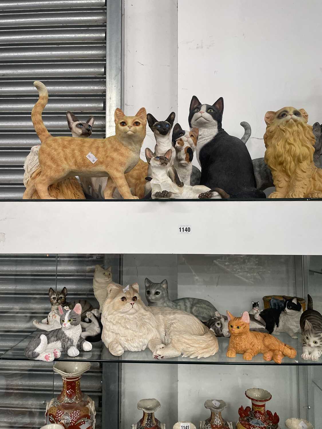 Lot 1140 - A collection of cat figurines by Leonardo...