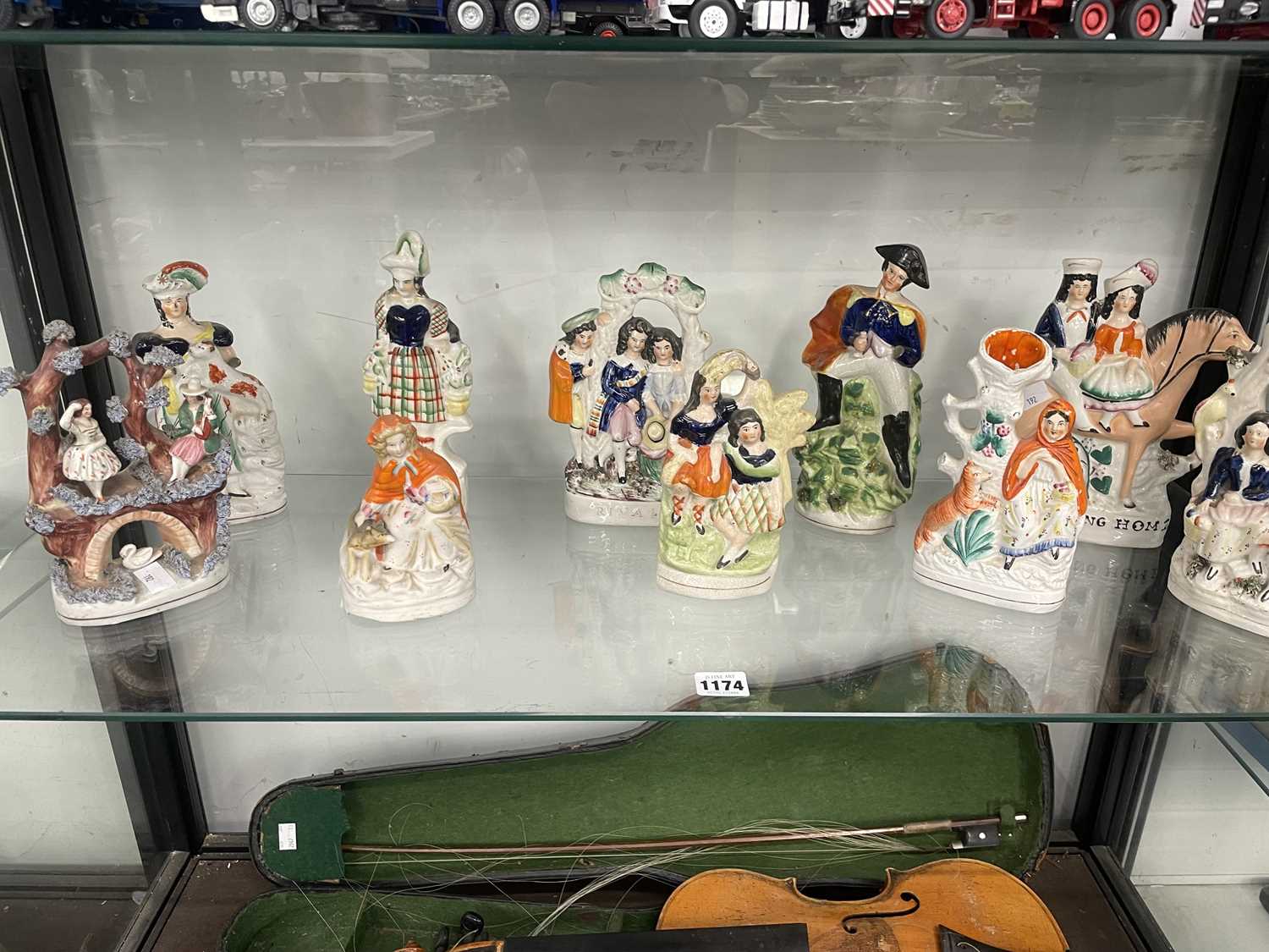 Lot 1174 - Ten Staffordshire flat back groups and figures
