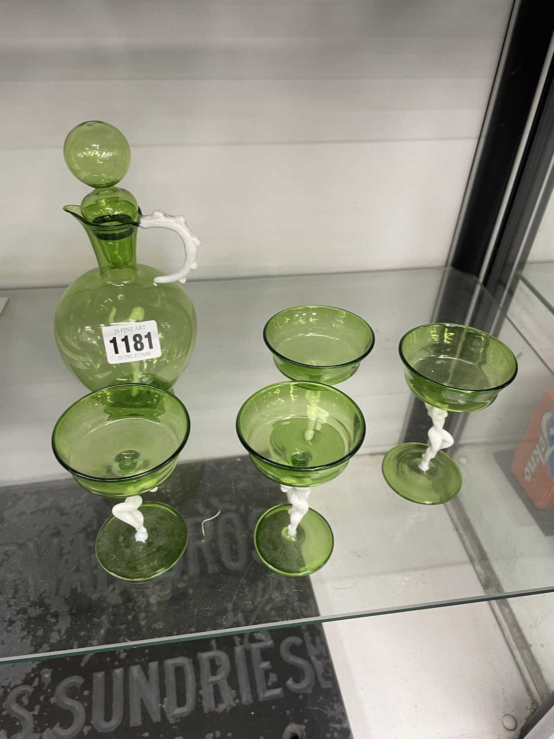 Lot 1181 - A green glass decanter and four cocktail...