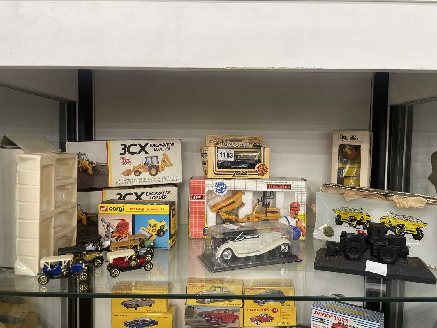 Lot 1183 - Boxed die cast JCB and heavy good vehicles,...