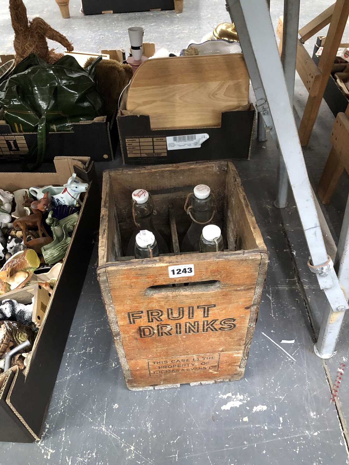 Lot 1243 - A wooden case of four Corona bottles