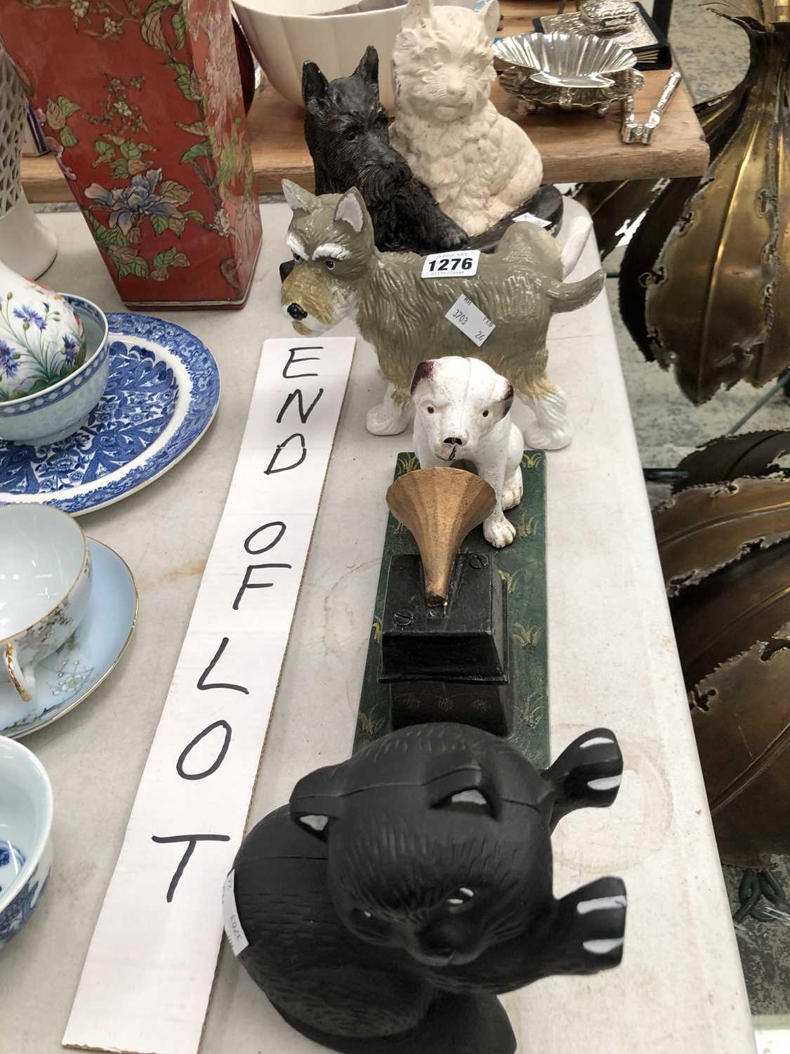 Lot 1276 - Four iron figures of a cat, a HMV dog, Black...