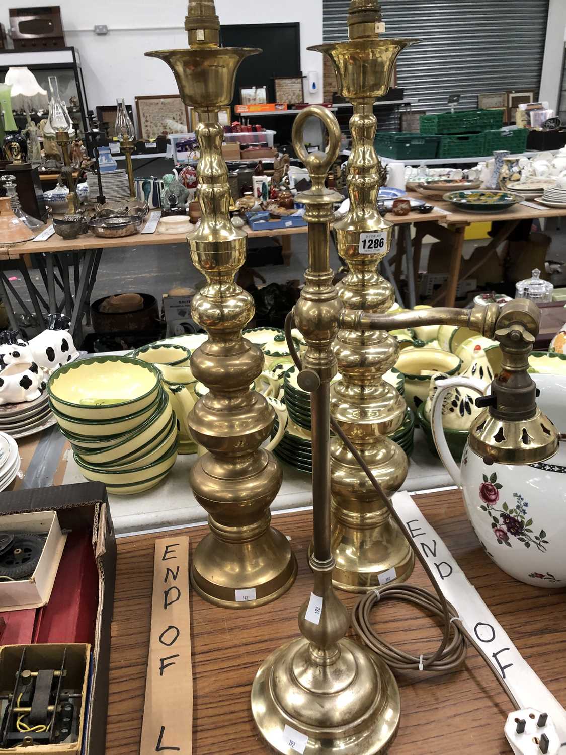 Lot 1286 - A pair of brass bobbin turned table lamps and...