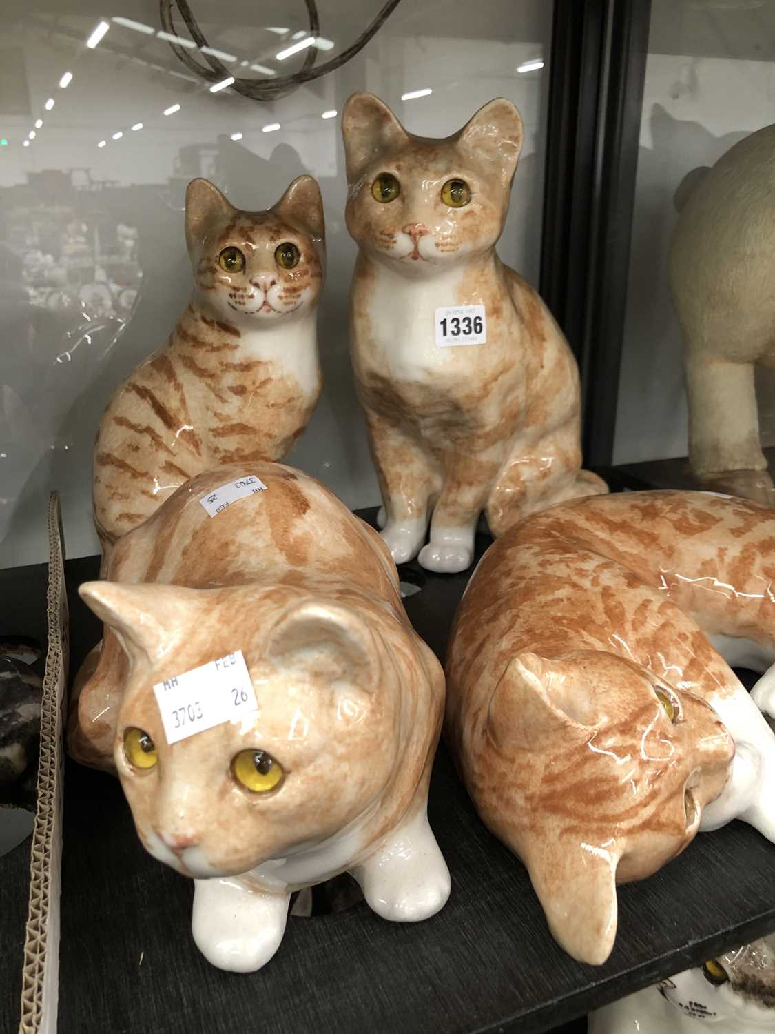 Lot 1336 - Four Winstanley pottery ginger cats