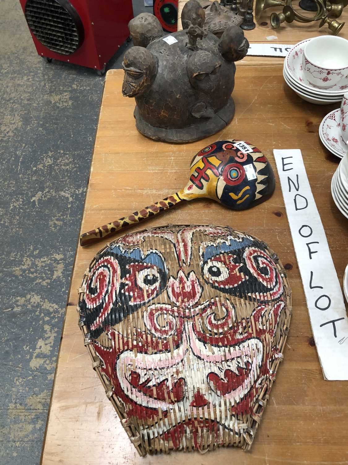 Lot 1351 - An African carved wood helmet mask, a South...