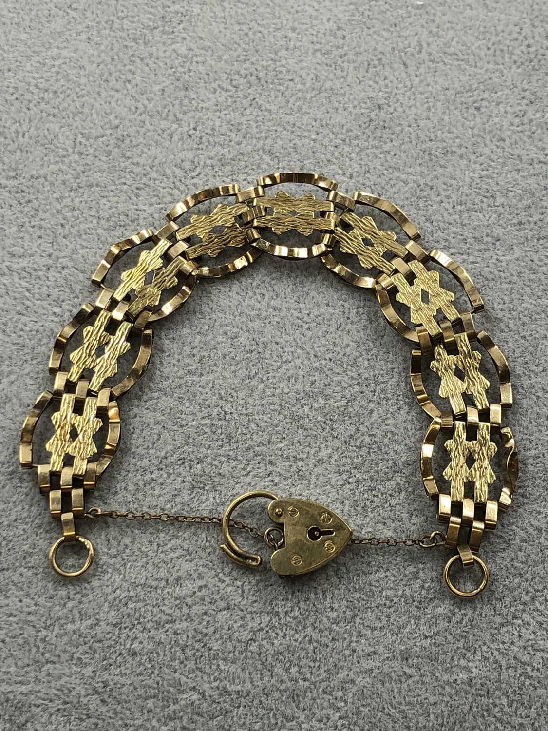 Lot 268 - A 9ct hallmarked gold fancy link gate bracelet...