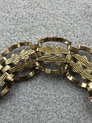 Lot 268 - A 9ct hallmarked gold fancy link gate bracelet...