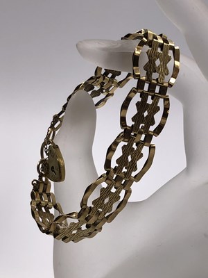 Lot 268 - A 9ct hallmarked gold fancy link gate bracelet...